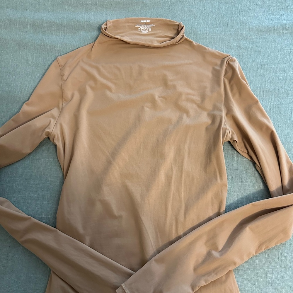 Skims high neck top